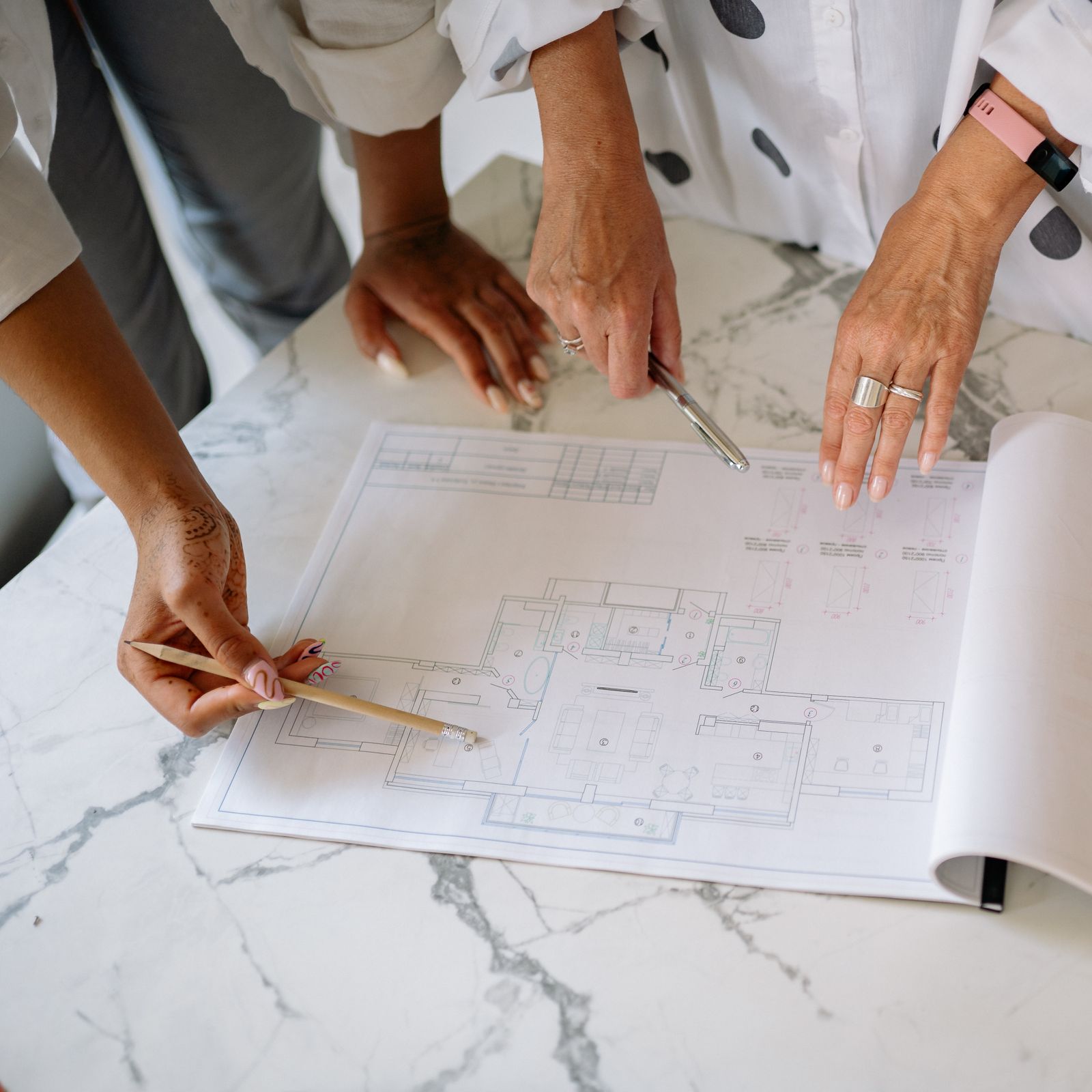 Designers reviewing drawings and project choices together