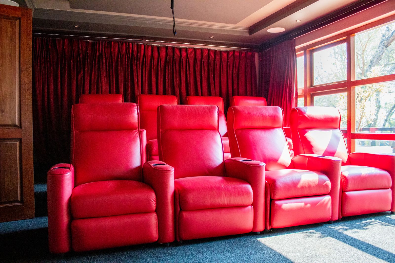 Editorial photograph of a dedicated home entertainment room